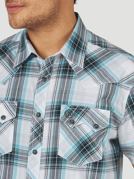 Wrangler 10MV4033Q Mens Retro Short Sleeve Plaid Shirt Teal collar and pocket close up. If you need any assistance with this item or the purchase of this item please call us at five six one seven four eight eight eight zero one Monday through Saturday 10:00a.m EST to 8:00 p.m EST