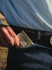 Montana Silversmiths MCL5235 Two-Tone Carved Longhorn Money Clip Silver on model. If you need any assistance with this item or the purchase of this item please call us at five six one seven four eight eight eight zero one Monday through Saturday 10:00a.m EST to 8:00 p.m EST