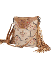 Myra Bag S-4376 Womens Accelerate Hand Tooled Bag Tan front view on an angle. If you need any assistance with this item or the purchase of this item please call us at five six one seven four eight eight eight zero one Monday through Saturday 10:00a.m EST to 8:00 p.m EST