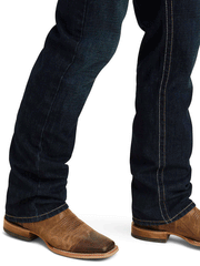Ariat 10043189 Mens M5 Straight Winfield Straight Jean Roadhouse leg bottom close up. If you need any assistance with this item or the purchase of this item please call us at five six one seven four eight eight eight zero one Monday through Saturday 10:00a.m EST to 8:00 p.m EST